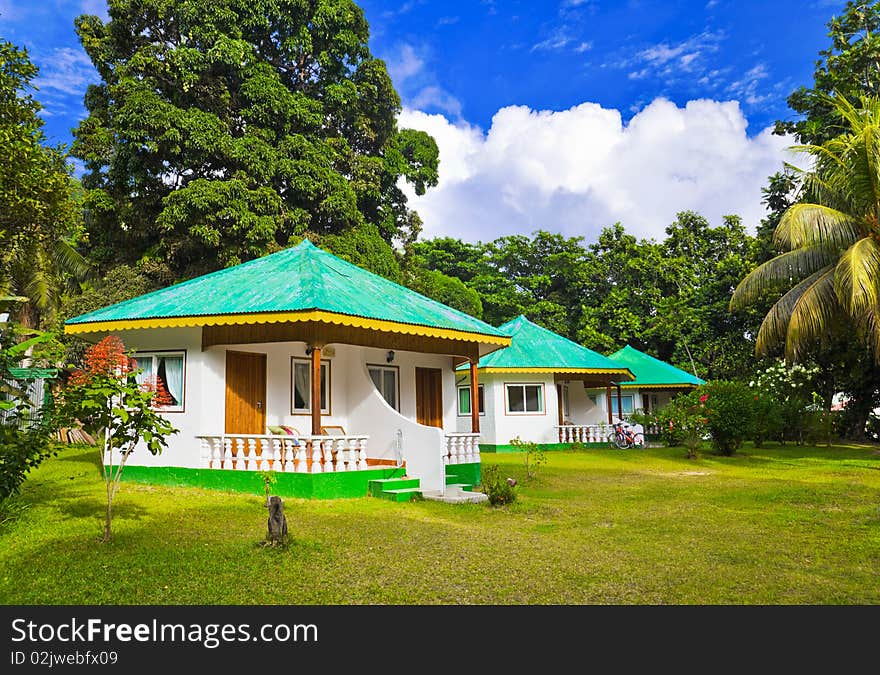 Bungalow in hotel at tropical beach - vacation background