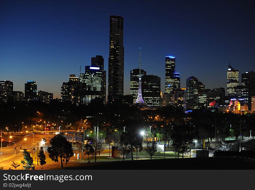 A city skyline at night. A city skyline at night.