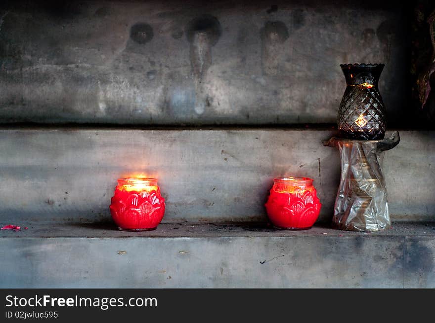 Candles burning, at the Longshan temple, Lukang, Taiwan. Longshan is a buddhist temple, one of the oldest in Lukang. Candles burning, at the Longshan temple, Lukang, Taiwan. Longshan is a buddhist temple, one of the oldest in Lukang.