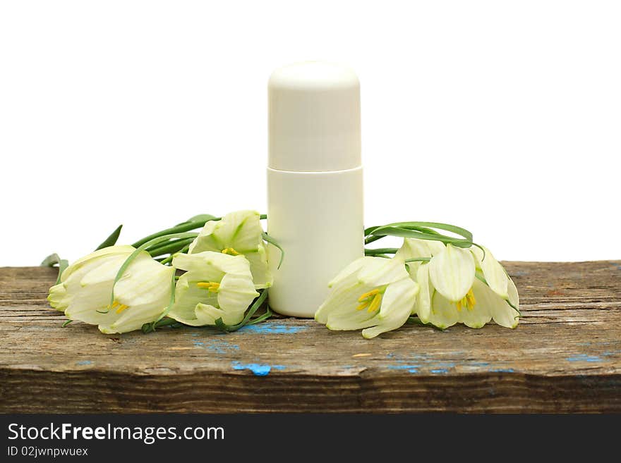 Deodorant cosmetic bottle and flower