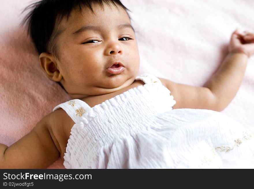 Ethnic Indian child with a coy expression. Ethnic Indian child with a coy expression.