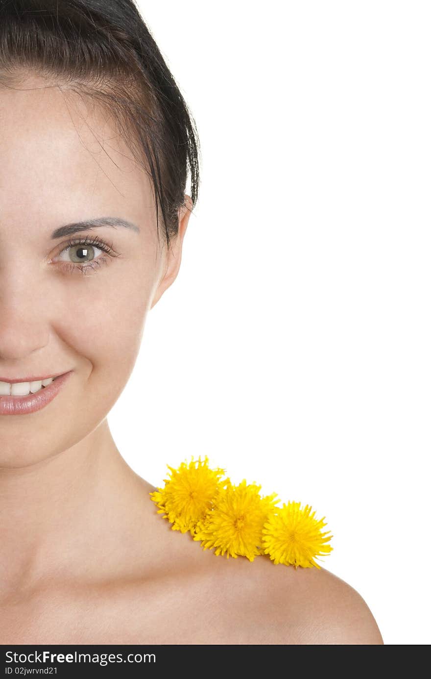 Three yellow flowers on shoulder at woman