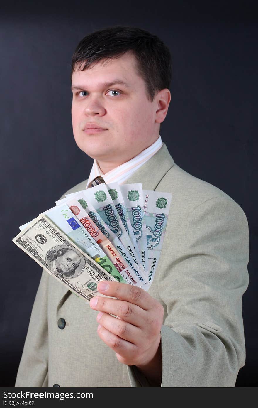 Man with money for a black background