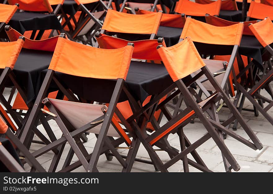 Tables and chairs in closed open-air cafe. Tables and chairs in closed open-air cafe