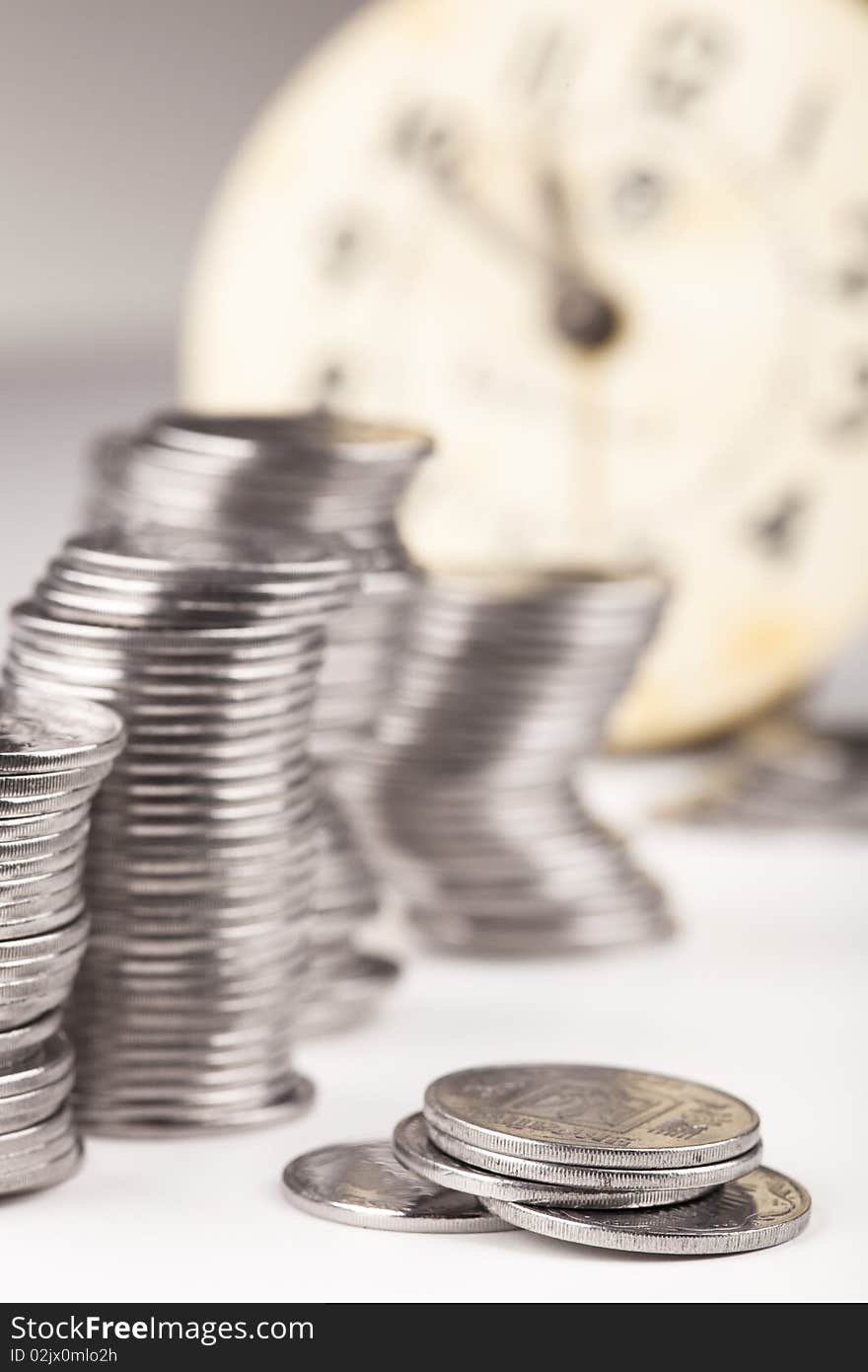 Coins against a clock