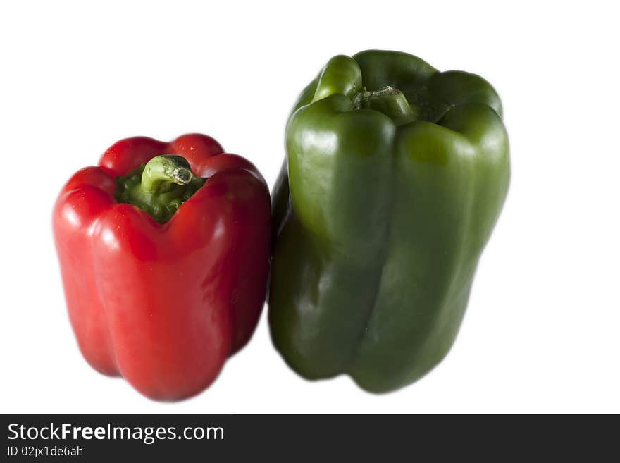 Red and green peppers on a white background