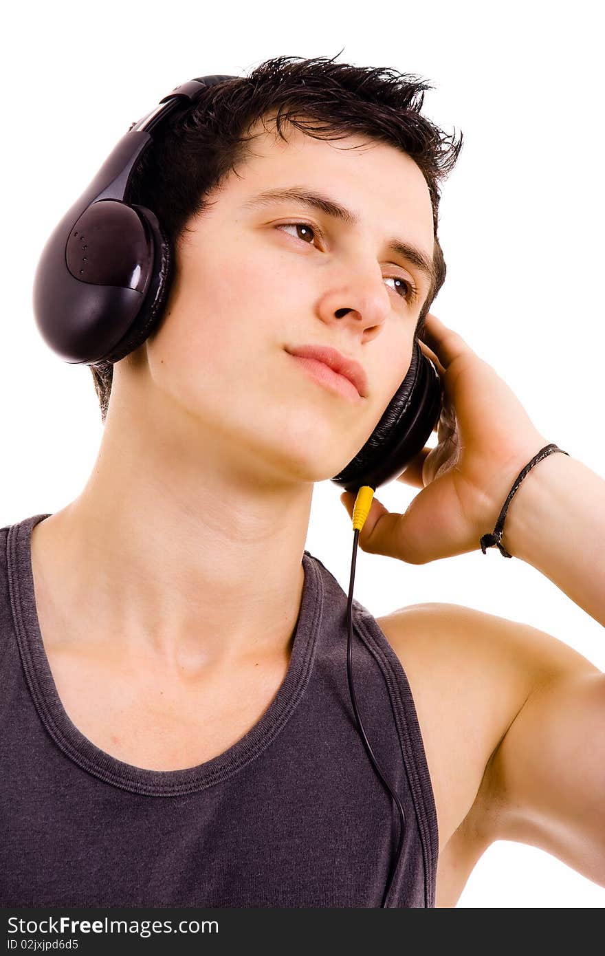 Young man listening music isolated on white