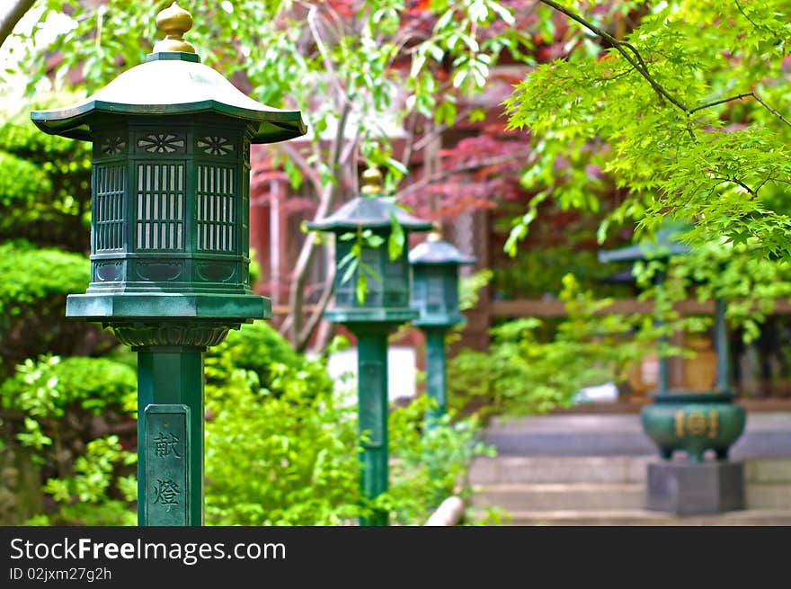 A row of lanterns in a Shinto Temple