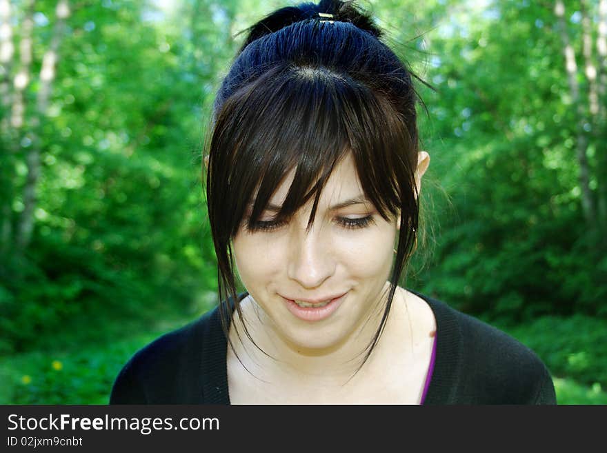 Looking down smiling girl portrait