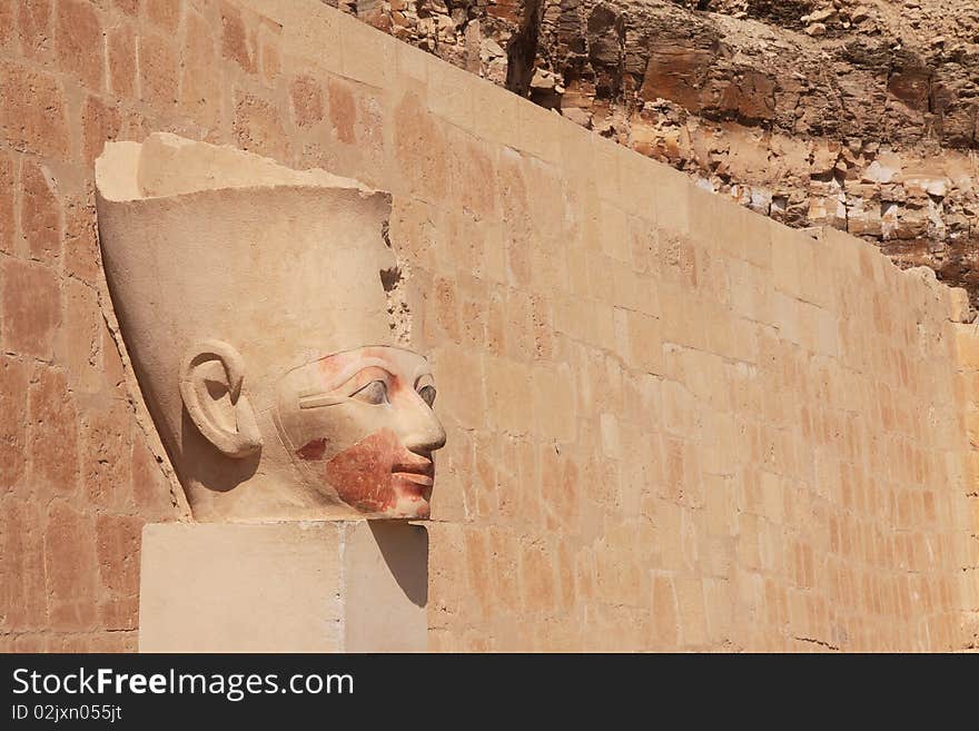 The ancient stone pharaoh's head in Egyptian temple