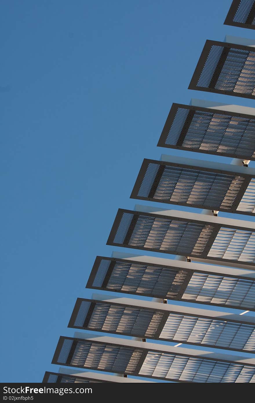 Architectural structure against blue sky at sunset