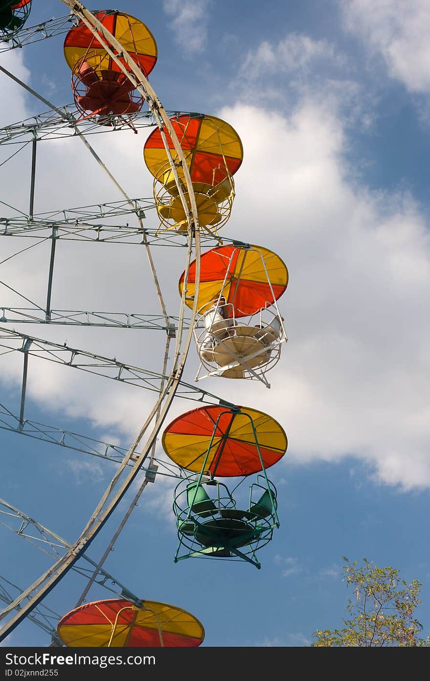 Old ferris wheel against blue sky