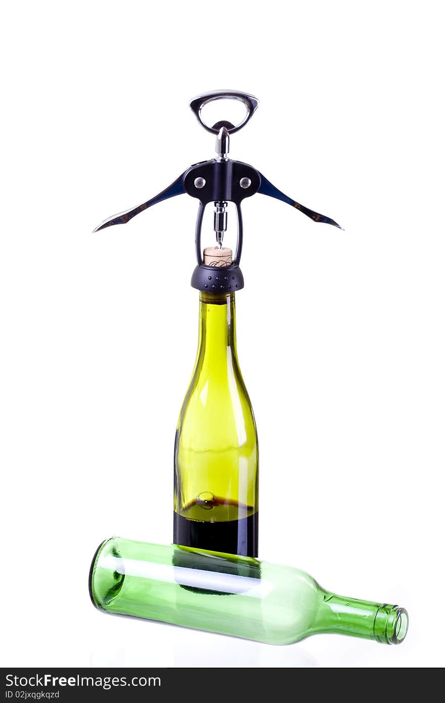 Corkscrew and green wine bottles. Corkscrew and green wine bottles