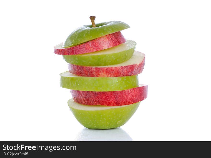 Photograph showing red and green apple slices isolated. Photograph showing red and green apple slices isolated