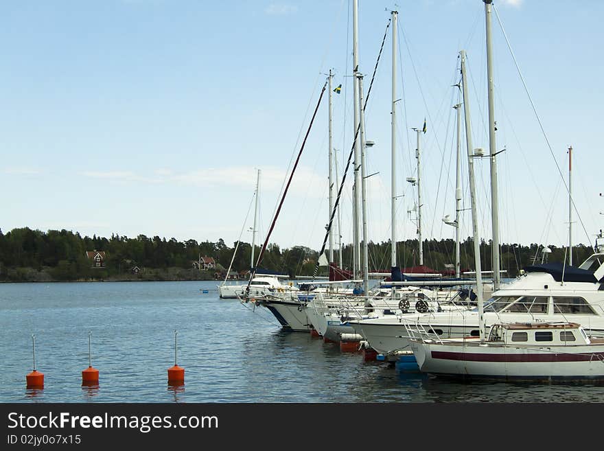 Quay with many boats anchored to the right