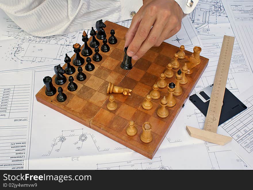 In lunch interruption engineer- designer in chess