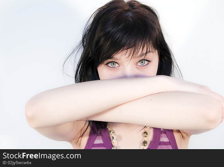 Beautiful Brunette Girl looking over hands