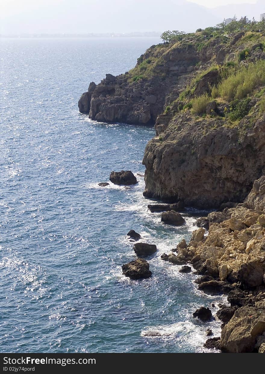 Cliffs and the sea and dark blue water