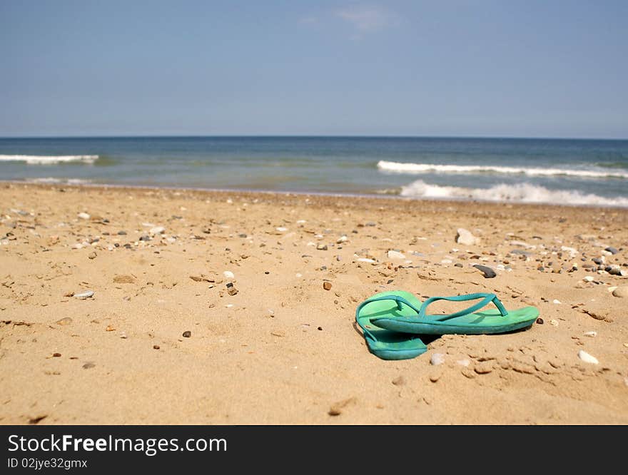 Green Flip Flops on Beach