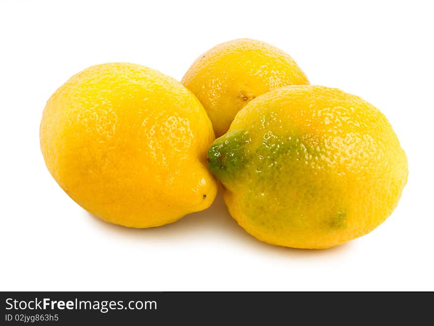 Three lemons isolated on a white background