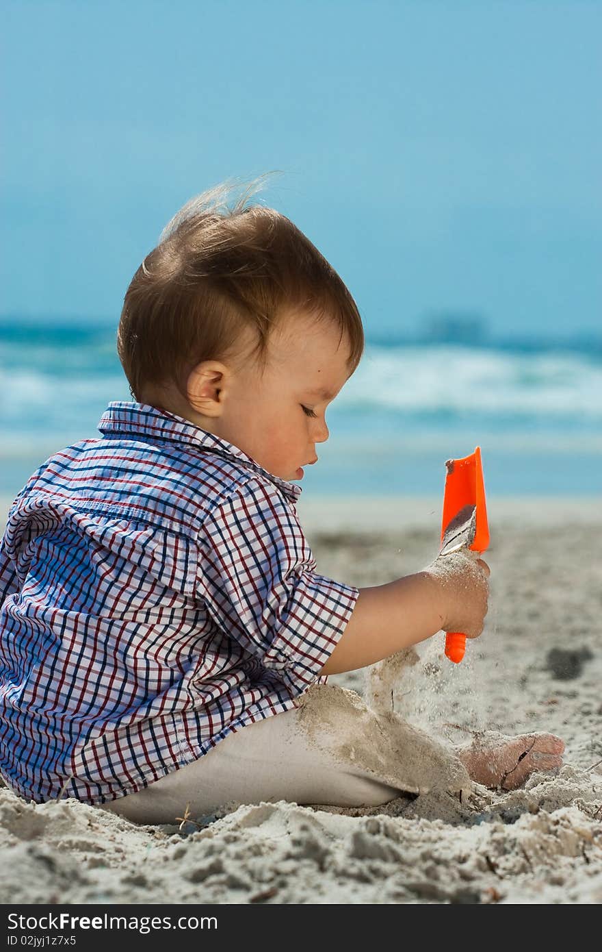 Child playing on a beach. Child playing on a beach