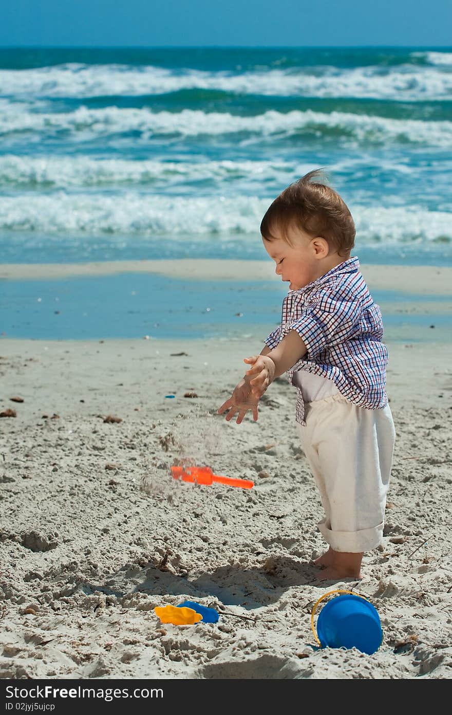 Child playing on a beach. Child playing on a beach