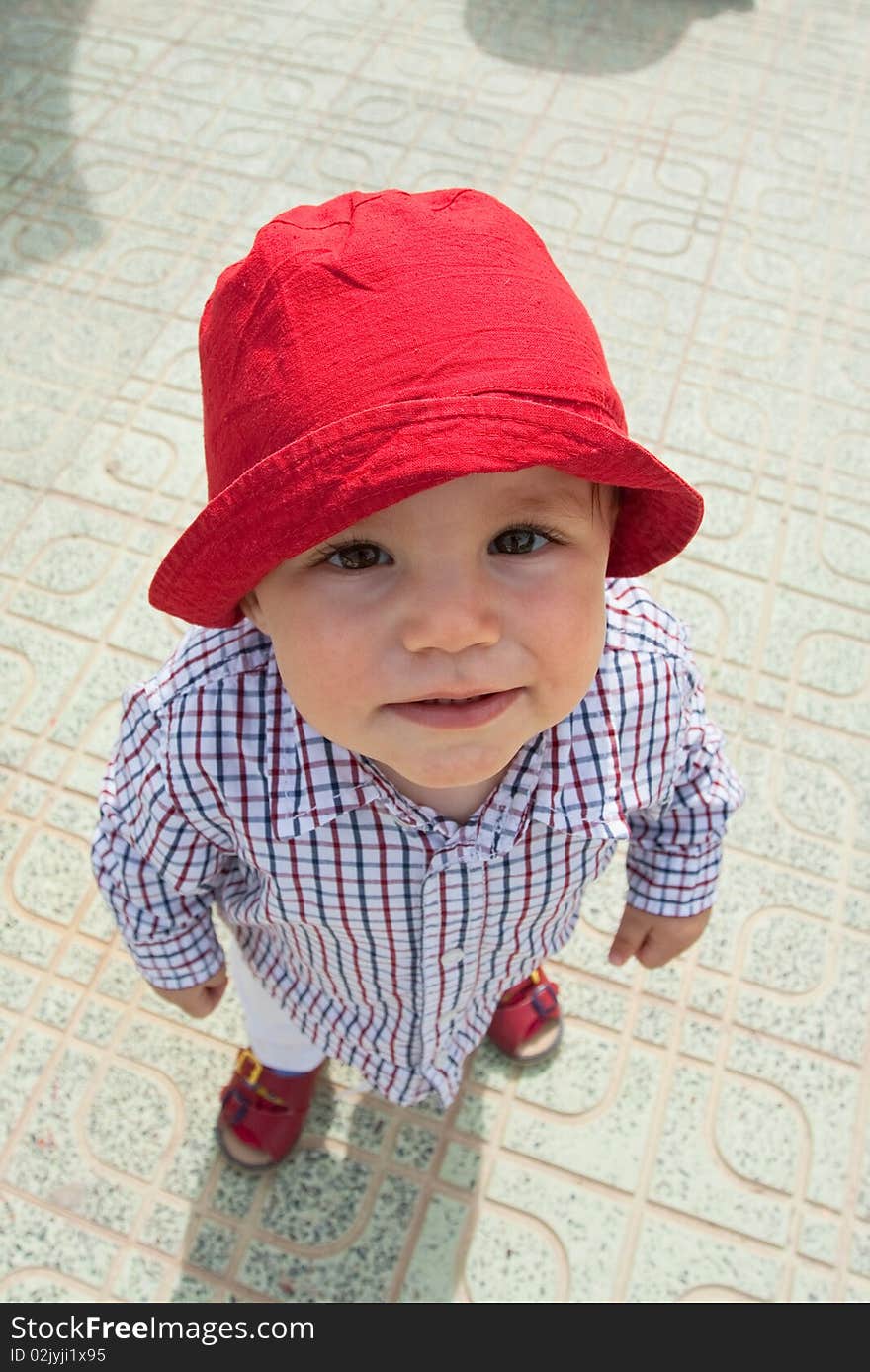 Outdoor portrait of funny boy (Wide-angle lens)