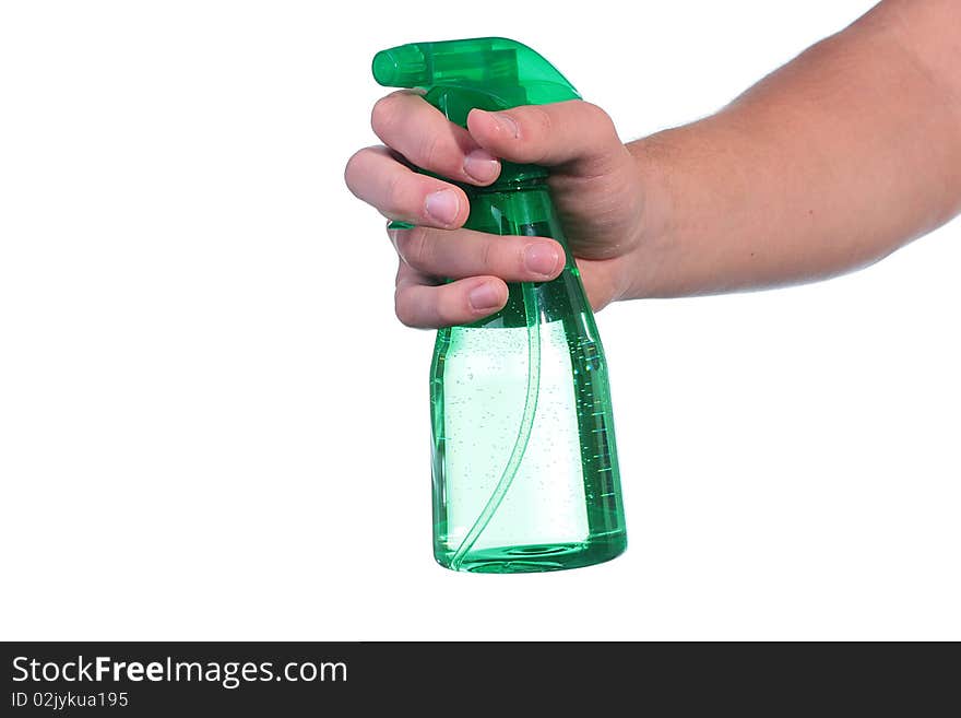 The man's hand holds a spray for water dispersion.