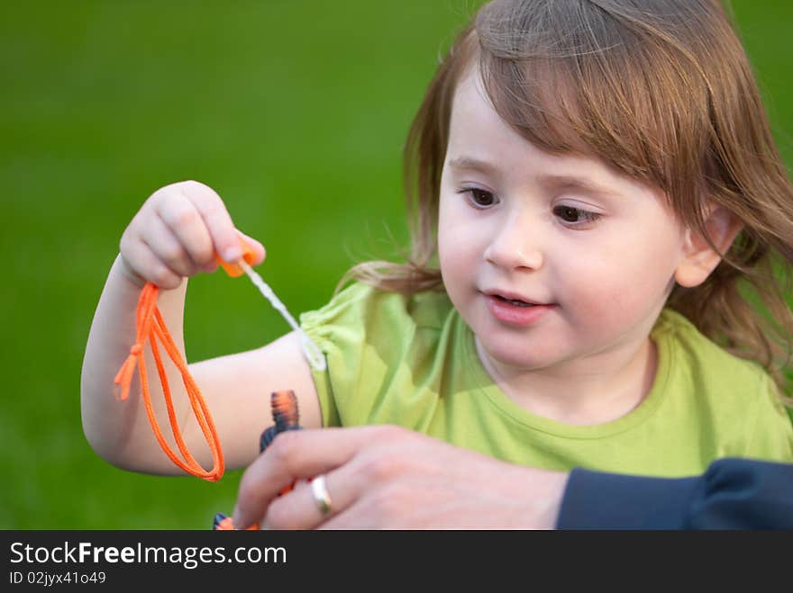 Little girl holding a bubble wand. Little girl holding a bubble wand