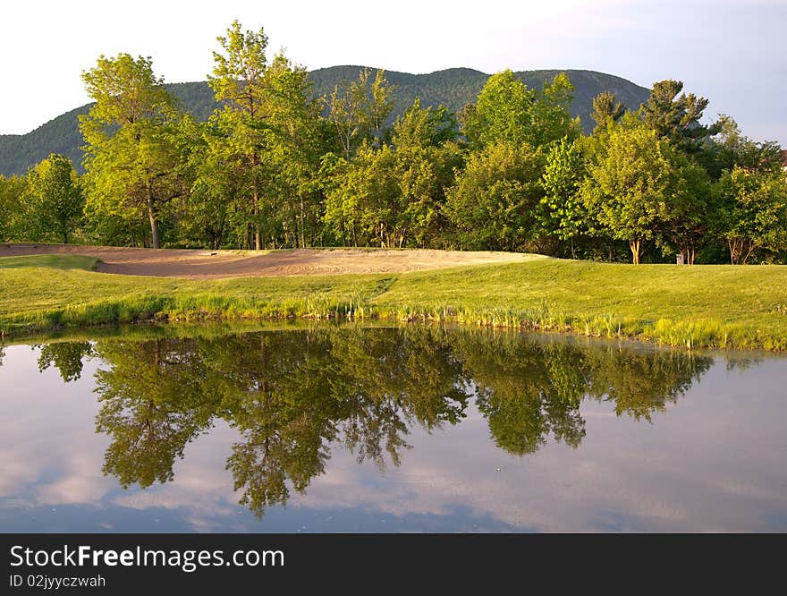 Beautiful golf course with focus on a sandtrap. Beautiful golf course with focus on a sandtrap