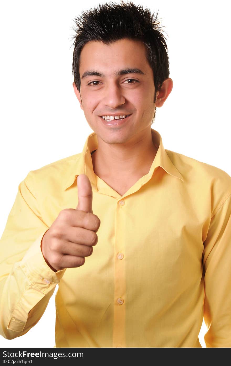 Smiling South Asian young businessman showing thumbs up