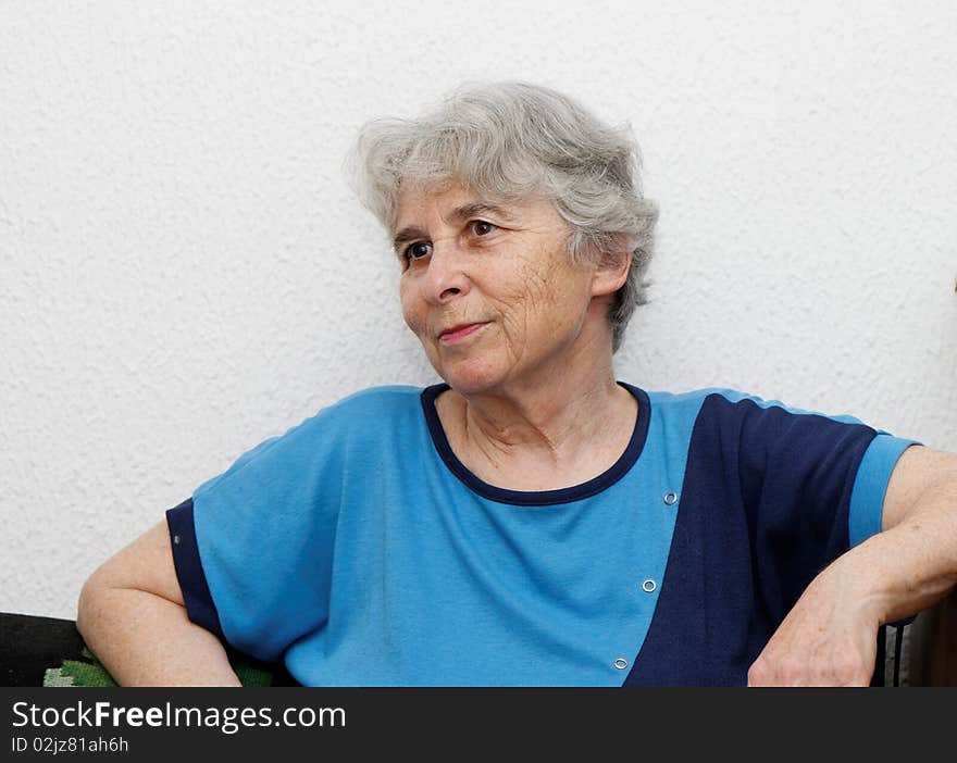 Relaxed elderly woman resting indoor