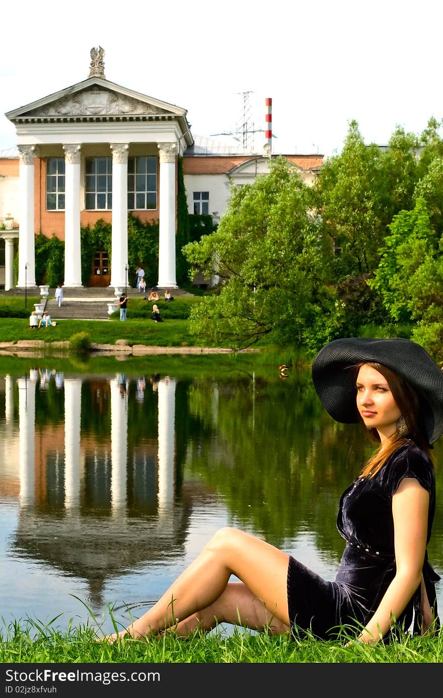 Attractive young woman near the pond. Attractive young woman near the pond