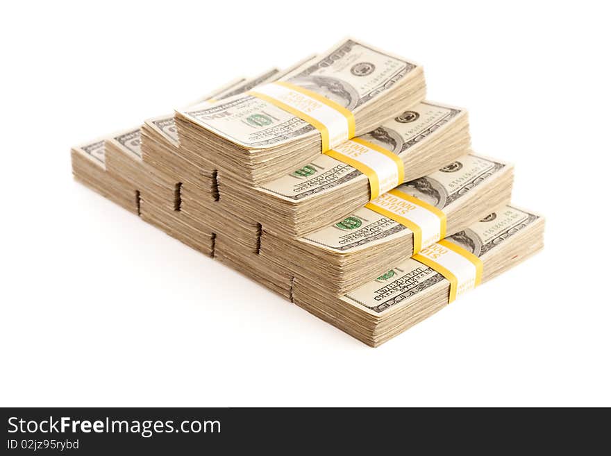 Stacks of Ten Thousand Dollar Piles of One Hundred Dollar Bills Isolated on a White Background. Stacks of Ten Thousand Dollar Piles of One Hundred Dollar Bills Isolated on a White Background.