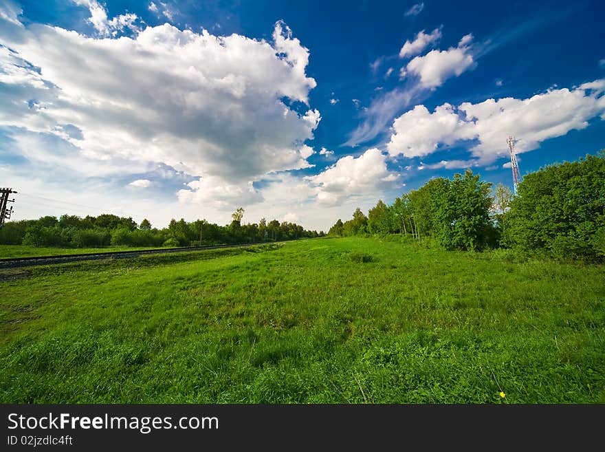 Blue sky with clouds and the green field. Blue sky with clouds and the green field