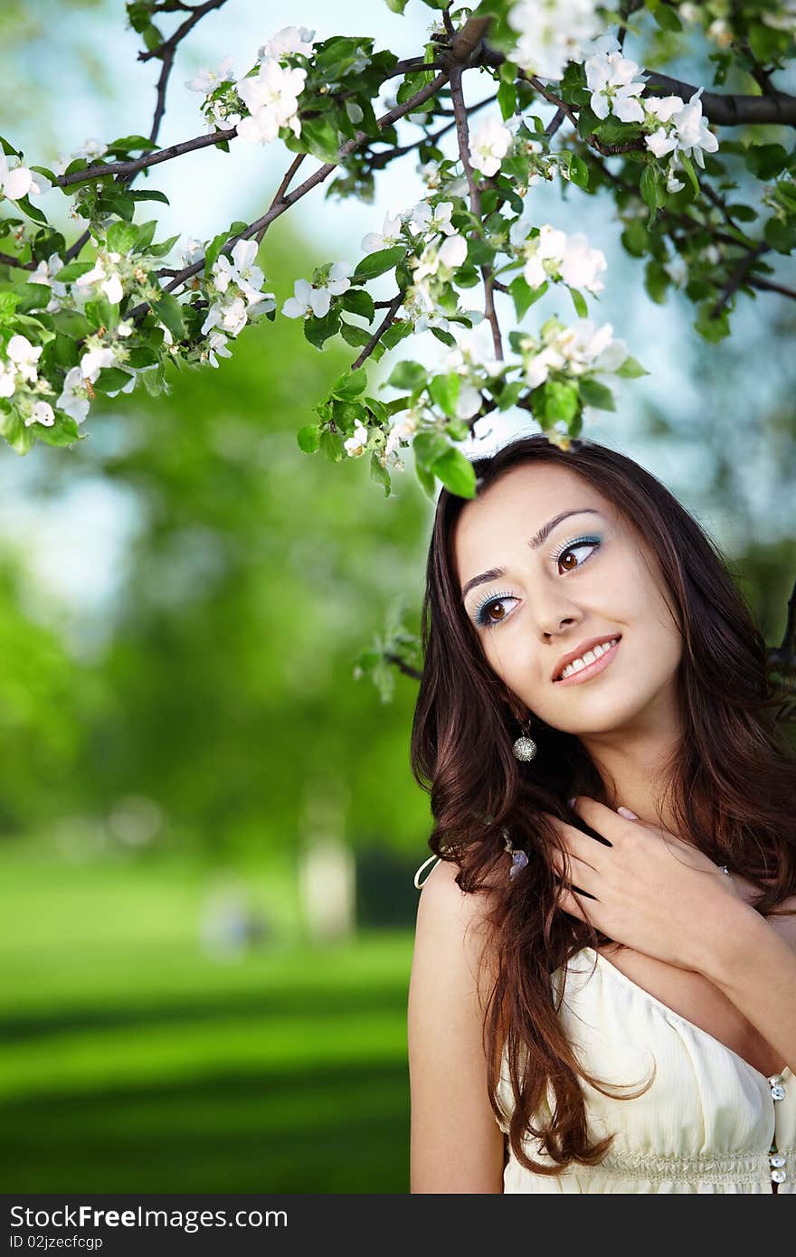 Portrait of the young girl in greens of trees. Portrait of the young girl in greens of trees