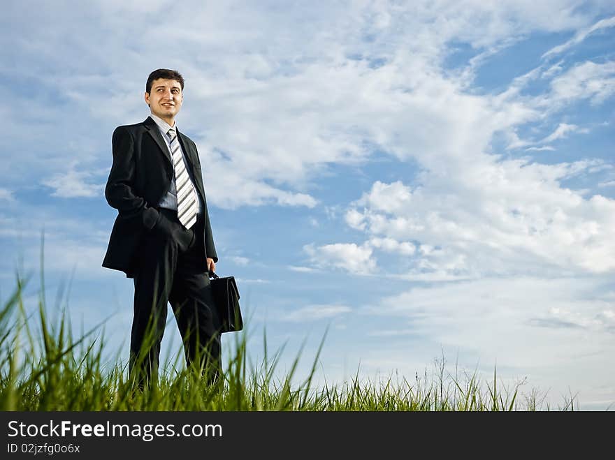 Businessman is staying outdoors