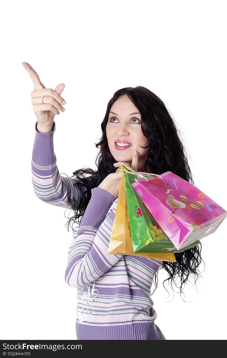 Charming young brunette holding colorful shopping bags. Charming young brunette holding colorful shopping bags