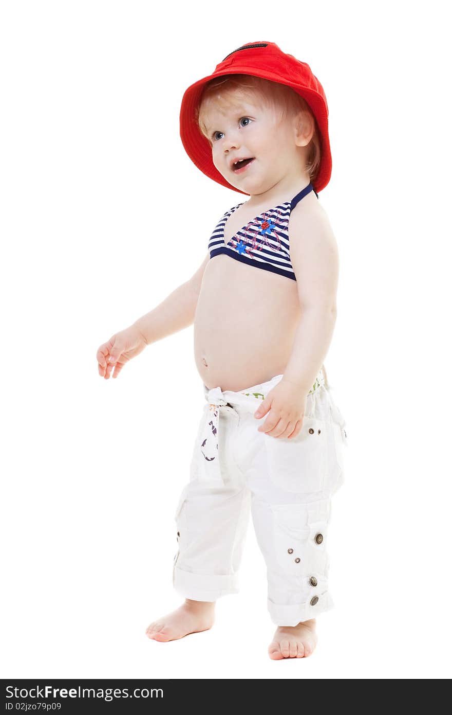 Baby girl in a swimsuit and red hat