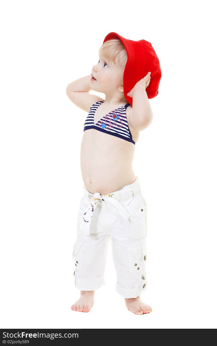 Baby girl in a swimsuit and red hat isolated on white