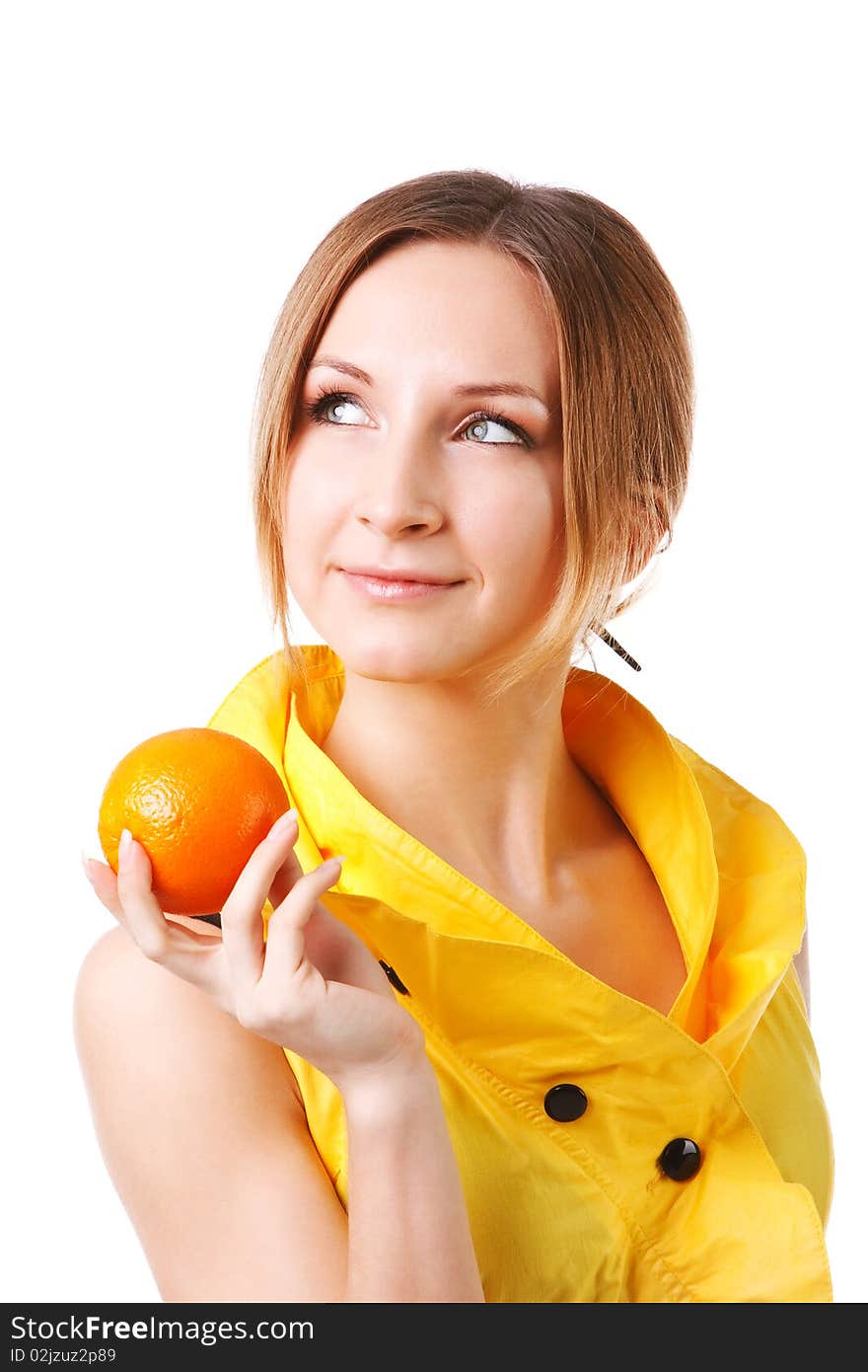 Young pretty girl in yellow dress with oranges