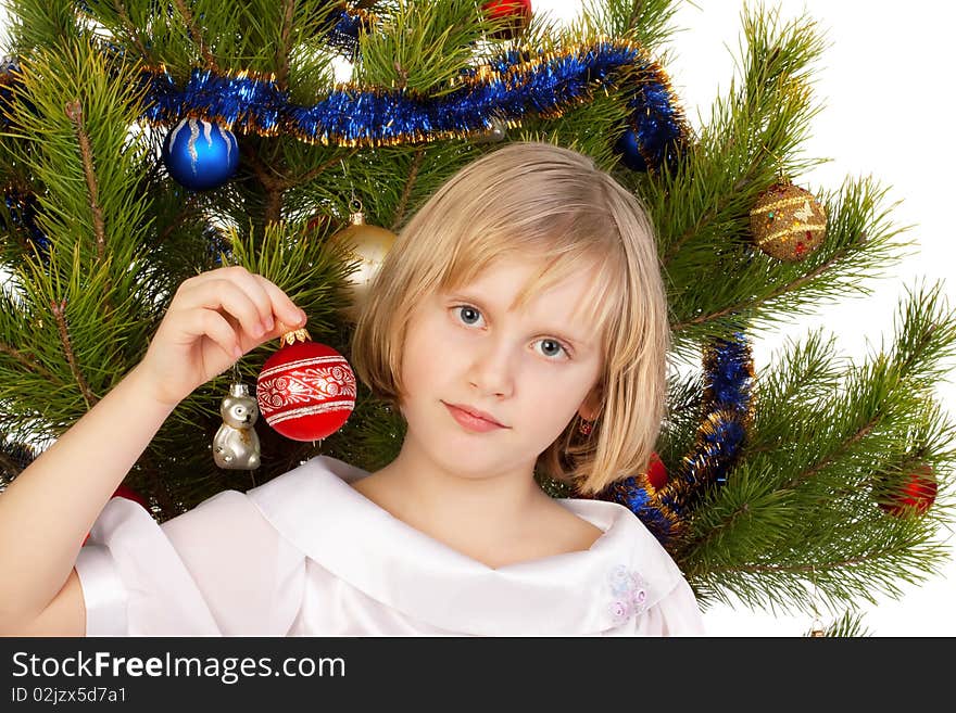 Nice girl decorates Christmas tree