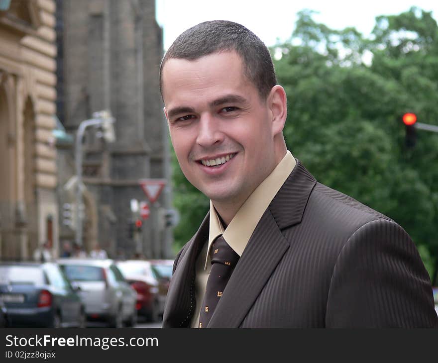 Portrait of businessman on the street near the intersection