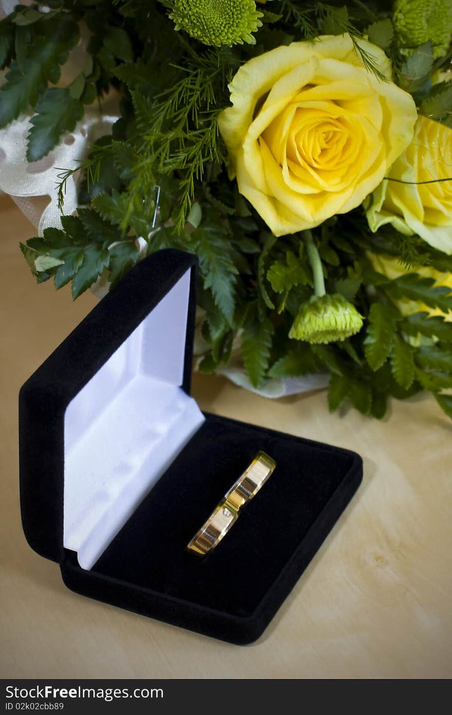 Wedding rings and yellow roses. Wedding rings and yellow roses