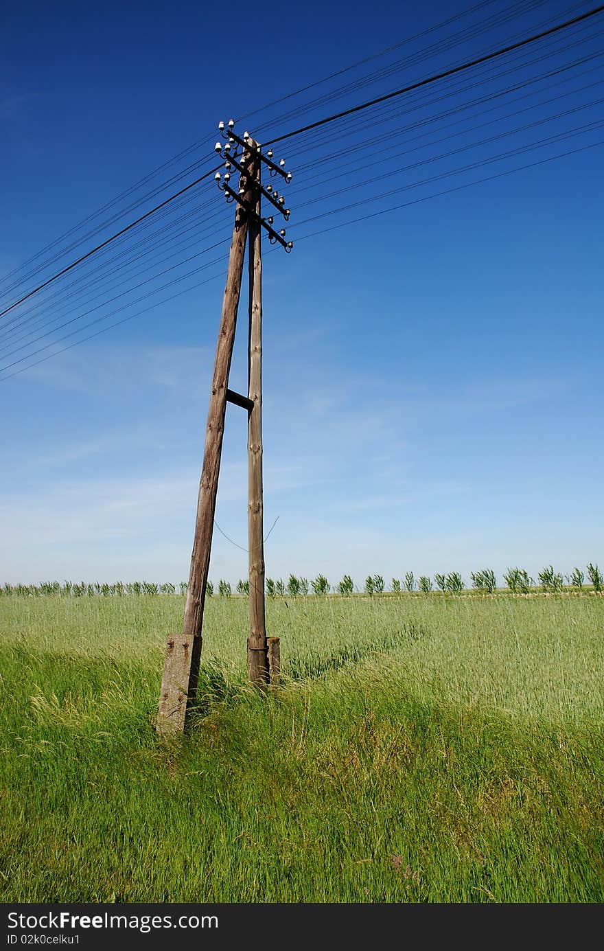 Power lines on the blue sky