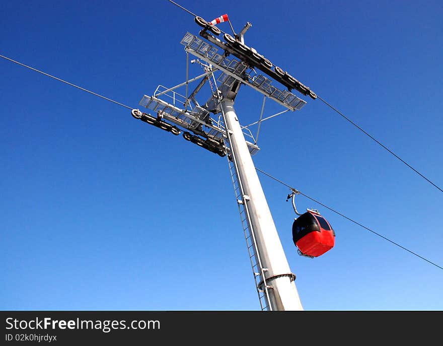 Winter landscape with a red cable car. Winter landscape with a red cable car