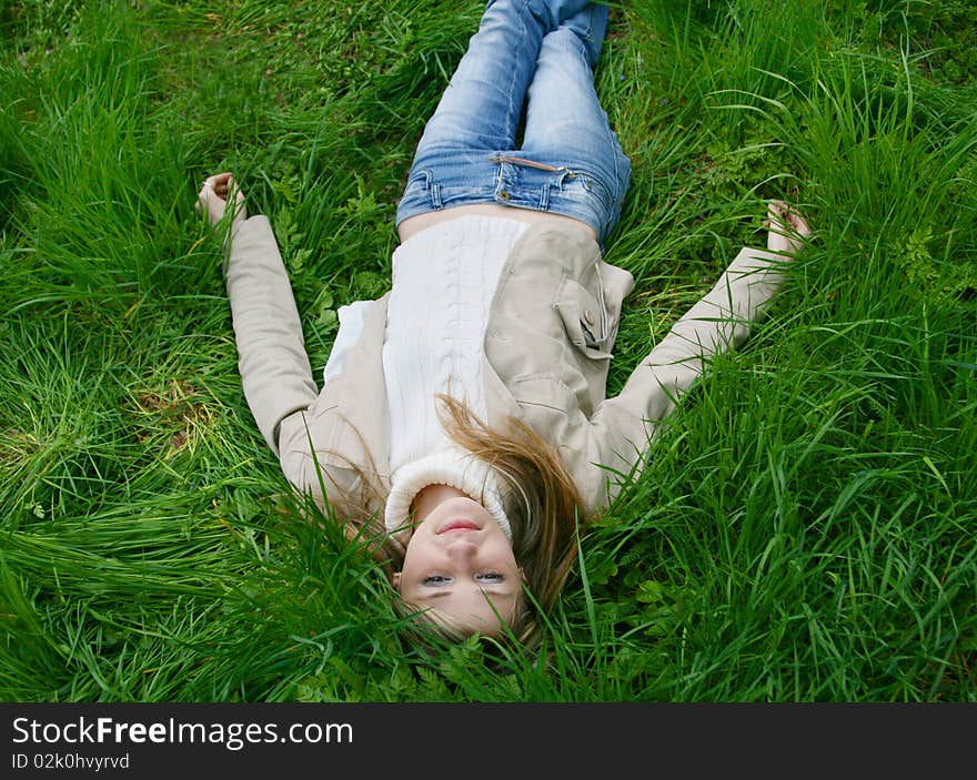 Girl lying in tall grass