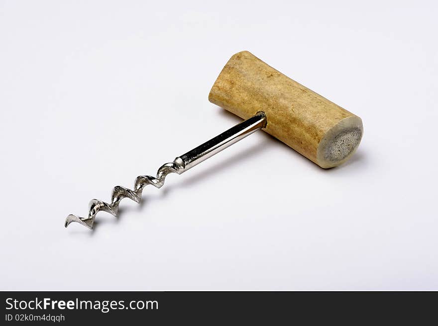 Vintage cork-screw on white background. Vintage cork-screw on white background