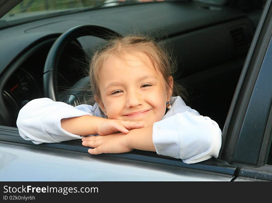 Young girl sitting in the car. Young girl sitting in the car