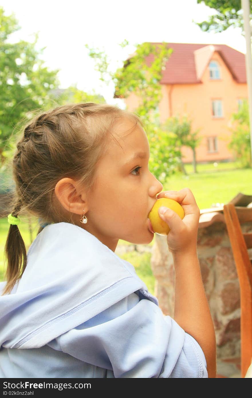 Young girl biting the apple. Young girl biting the apple